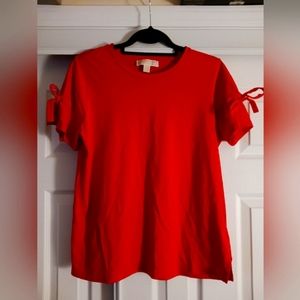 Ladies LARGE MICHAEL KORS short sleeve shirt with accent ties on each sleeve.